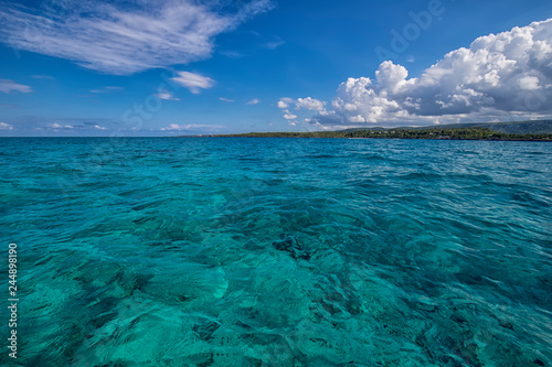 Beautiful landscape from Atlantic ocean to the coastline  turquoise water and blue sky with clouds. Cuba