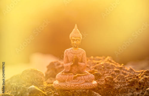 A buddha figure meditating on the coast photo