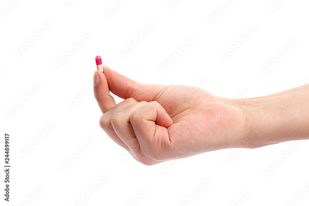 Pink pill in hand isolated on white background Pink pill in hand isolated on white background