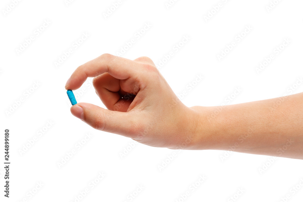 Blue pill in hand isolated on white background Blue pill in hand isolated on white background