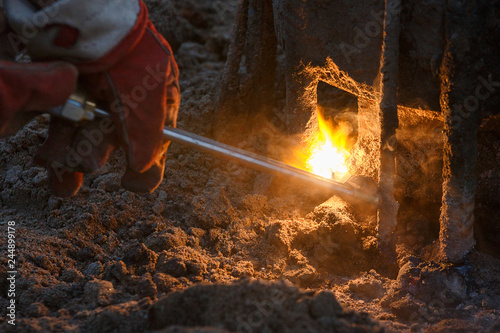 Welding machine with melting metal drops and sparks of sparks.