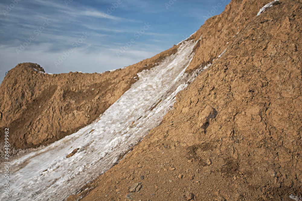 Clay soil landscape. Clay earth. Clay background. Red earth. 