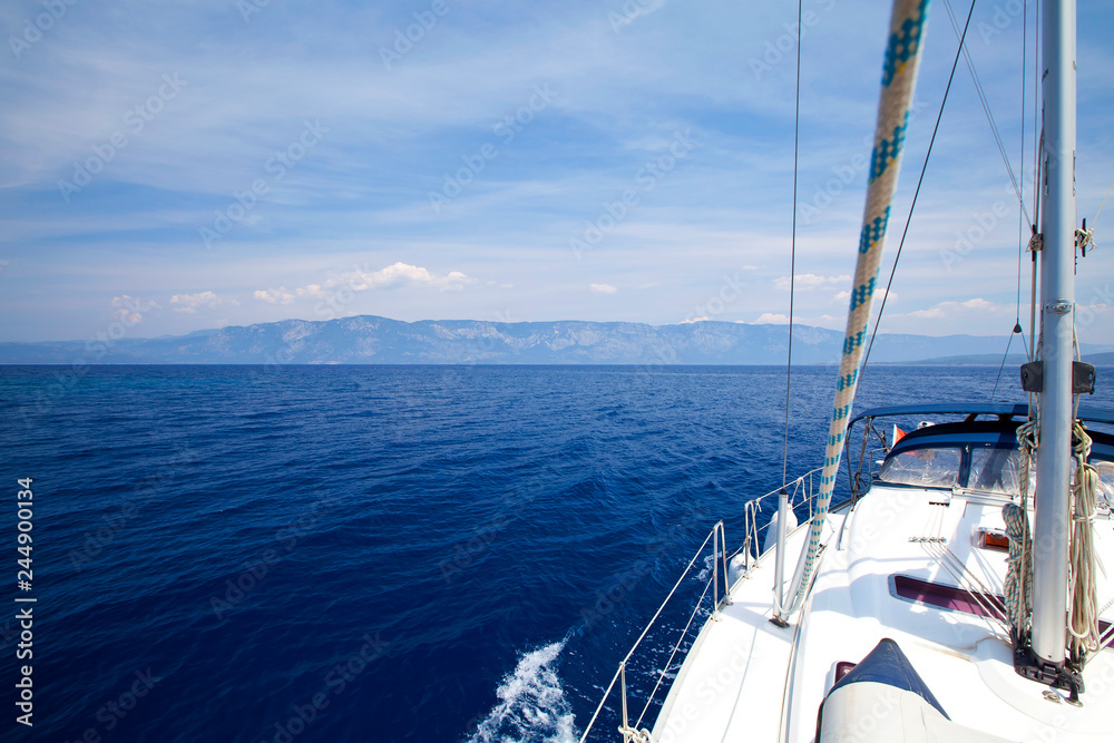 Fototapeta premium Sail boat gliding in open sea at sunshine. Aegean and mediterranean sea side of Turkey. Marmaris/Mugla