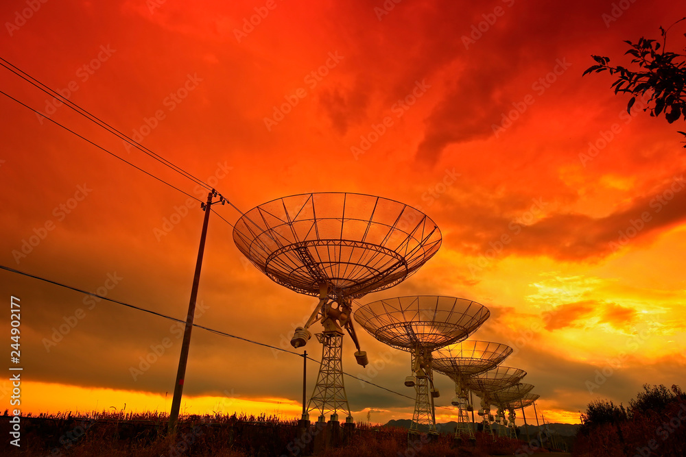 The silhouette of a radio telescope observatory The silhouette of a radio telescope observatory