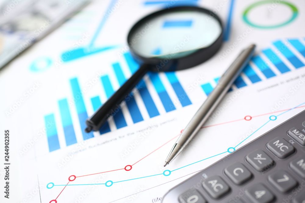 Silver calculator and financial statistics on clipboard