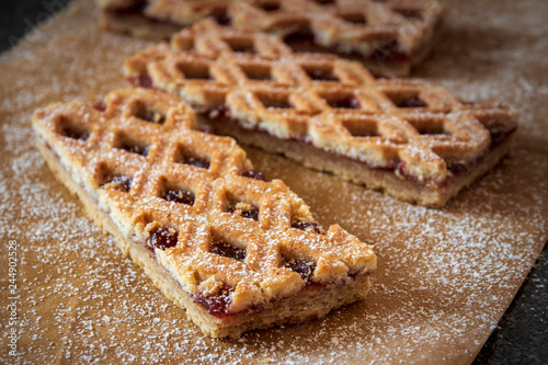 Linzer Torte is traditional Austrian cake with a lattice design on top of the pastry. Filled with jam.
