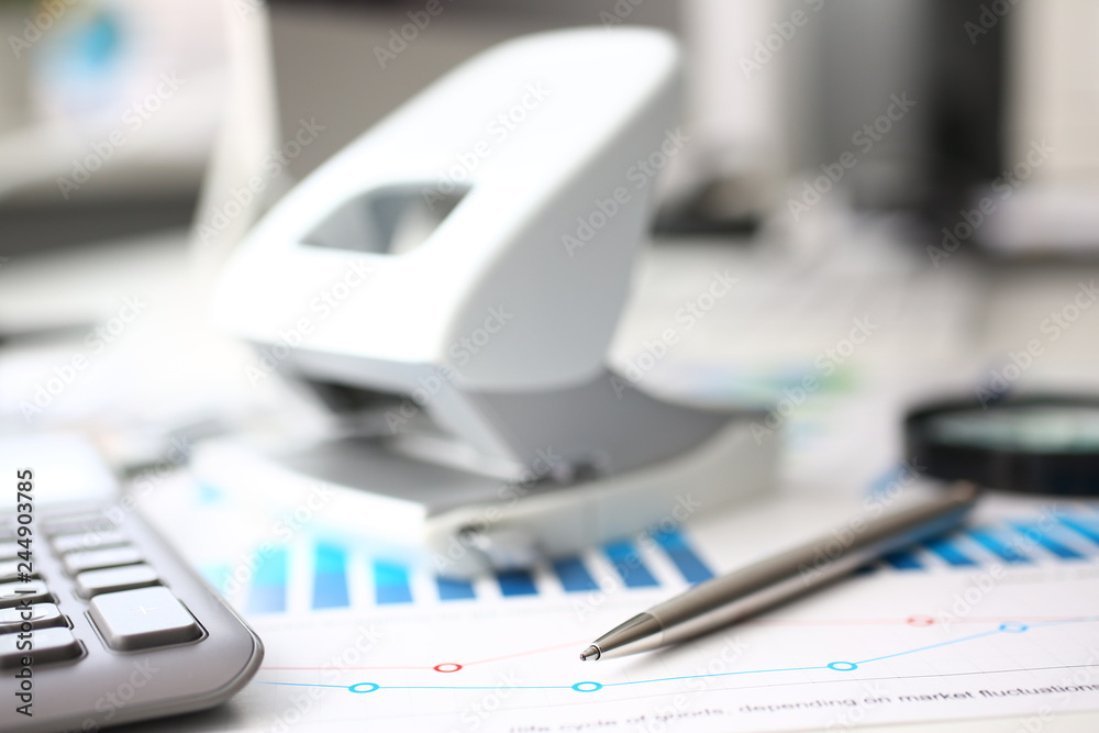 Silver calculator and financial statistics on clipboard Silver calculator and financial statistics on clipboard