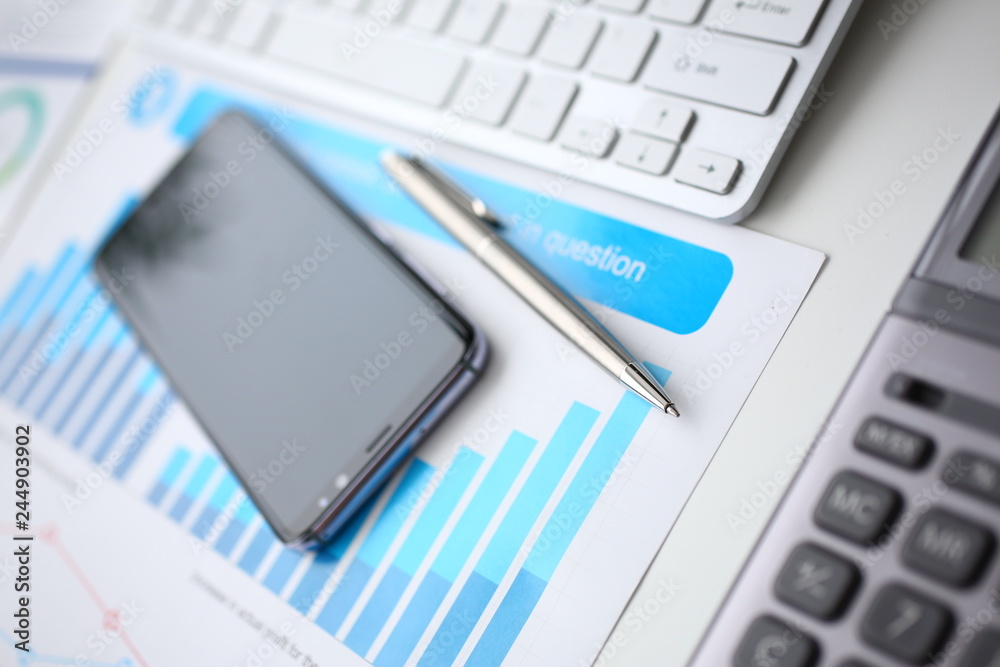Silver calculator and financial statistics on clipboard