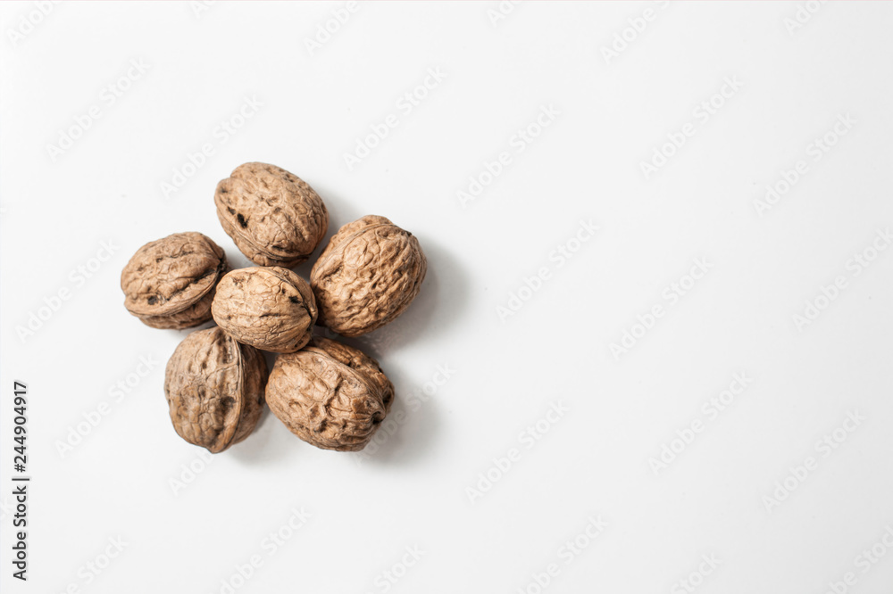 Useful walnuts, close-up, isolated on white background. Useful walnuts, close-up, isolated on white background.