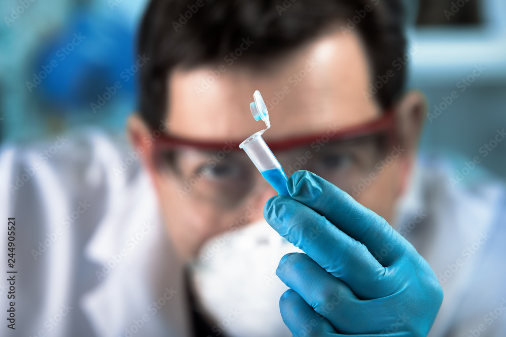 Technician researcher holding pcr tube for analytical in the clinical laboratory / doctor geneticist working with biological sample in tube in genetic lab Technician researcher holding pcr tube for analytical in the clinical laboratory / doctor geneticist working with biological sample in tube in genetic lab