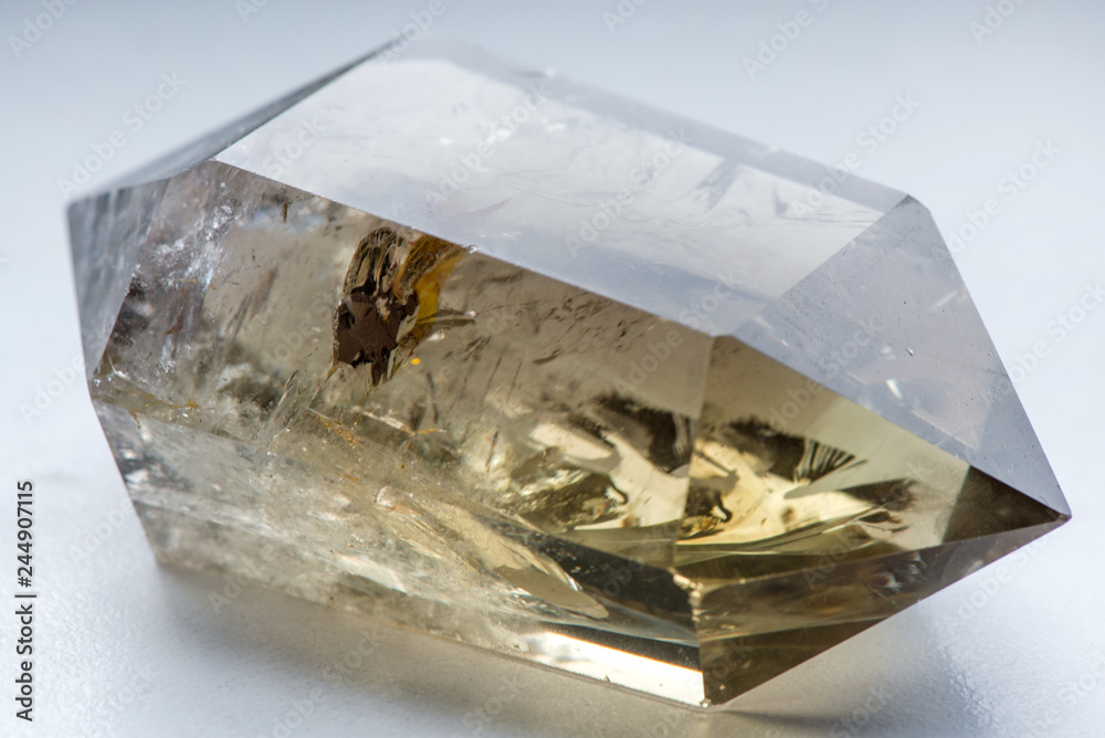 Macro Shot Of Citrine Stone On White Background Yellow Clear Crystal With A Dark Smokey Color Smoky Quartz With Ornaments And Rainbows In It Powerful Source Of Energy And Healing Stock Photo