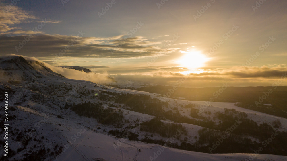 Mountain winter landscape. Fantastic morning glowing by sunlight.