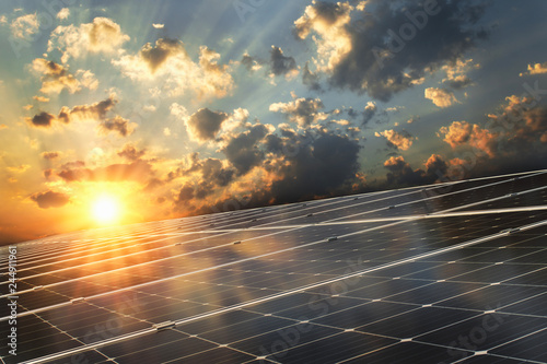 solar panel with sunset background. concept clean energy photo