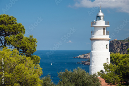 Cap Gros lighthouse on hill in Port Soller, Mallorca Island, Spain photo