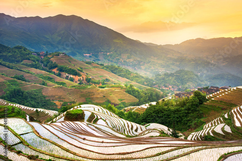 Sunset over terraced rice field in Longji, Guilin in China