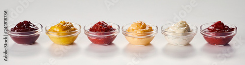 Small bowls of assorted sauces and dressings
