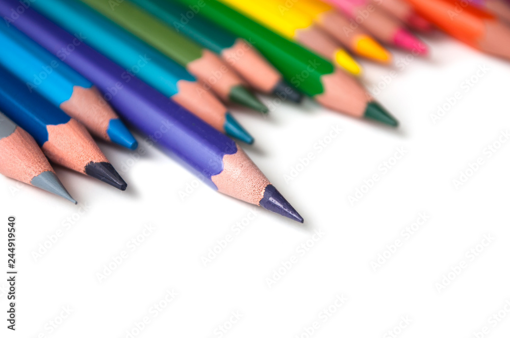 closeup of colouring pencils set on white background closeup of colouring pencils set on white background