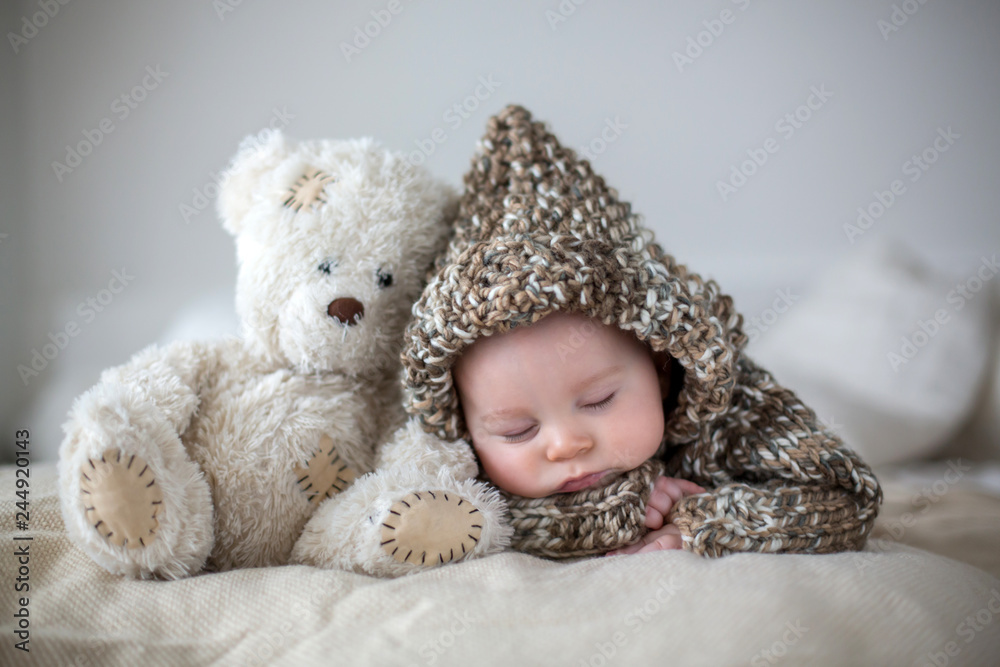 Little baby boy , sleeping at home with soft teddy bear toys - obrazy, fototapety, plakaty 
