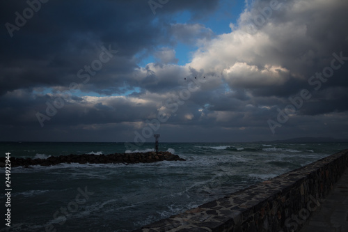 strong wind and waves on coastal road