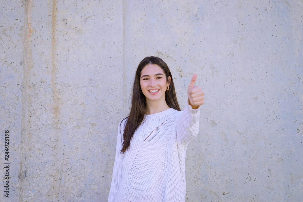 Happy girl with perfect white teeth and smile wearing a white sweater looking at camera - Image Happy girl with perfect white teeth and smile wearing a white sweater looking at camera - Image