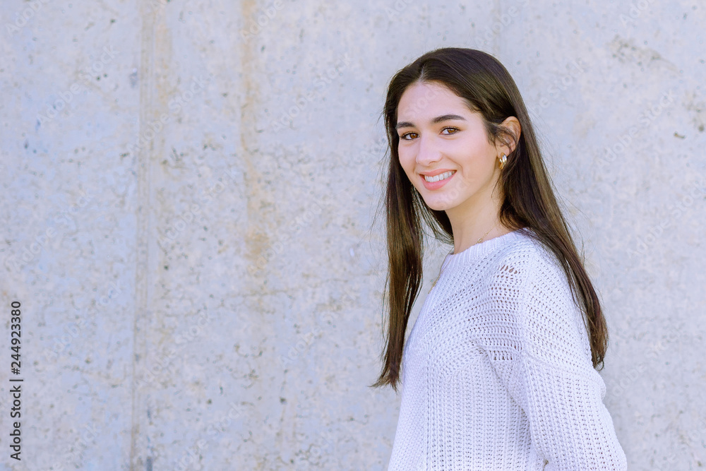 Portrait of a happy beautiful girl looking at camera - Image Portrait of a happy beautiful girl looking at camera - Image