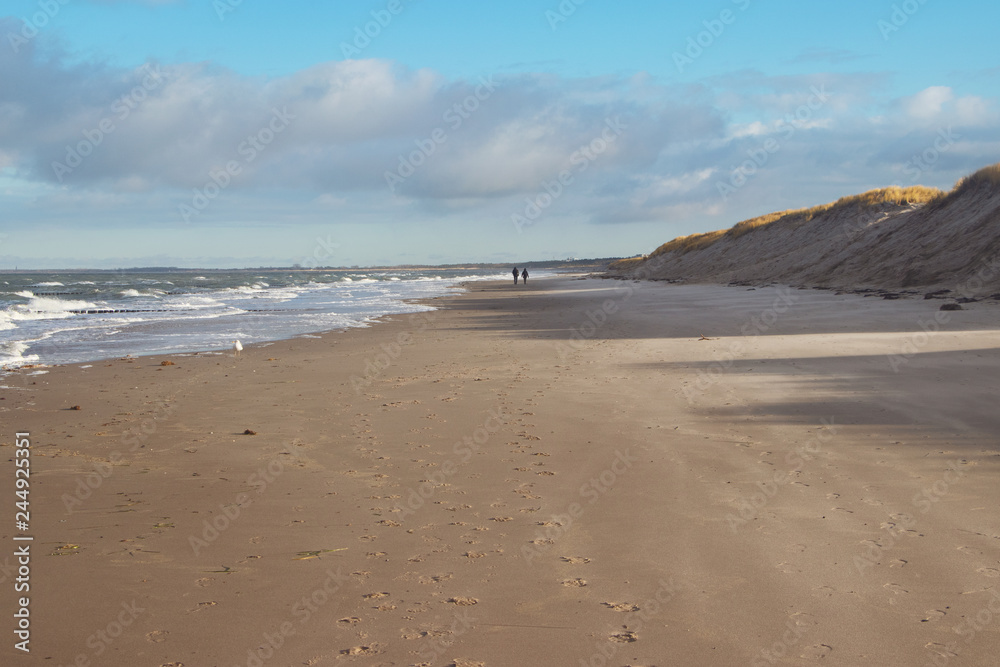 people walking at coast,baltic sea in winter