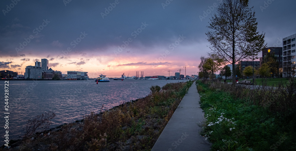 Sunset over amsterdam waterfront