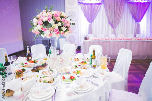 Interior of a restaurant prepared for wedding ceremony © olegparylyak