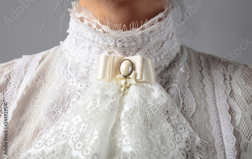 Obraz na płótnie Fragment of a Victorian dress with a brooch.