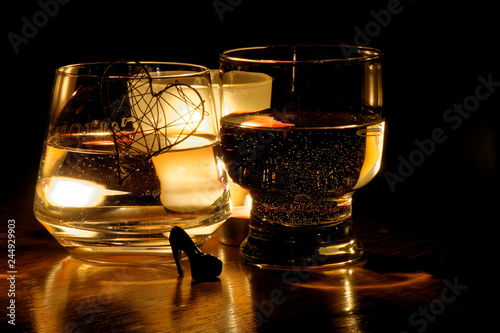 beautiful glasses in the flame of a candle © Oleksii Pyrogov