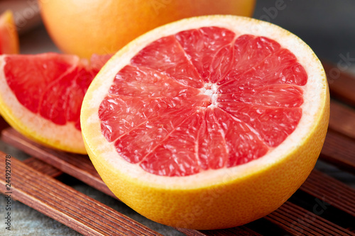 Fresh raw grapefruit  citrus x paradisi  on wooden background