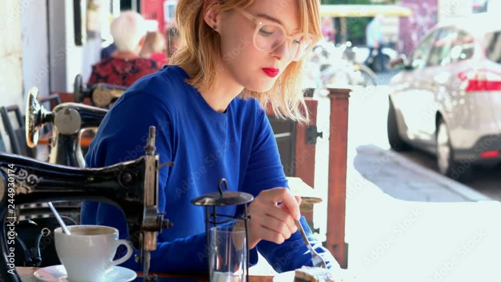 Happy young woman eating delicious cake in cafe, 4K
Happy young woman eating delicious cake in cafe, 4K
