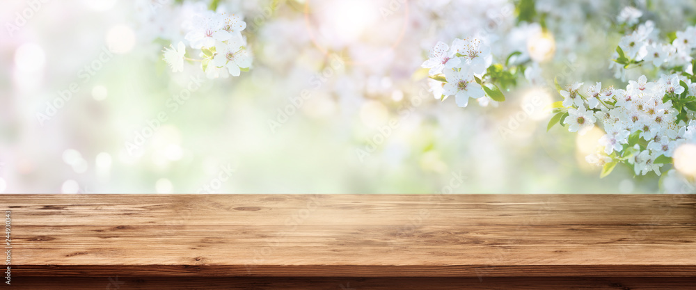 Spring blossoms with wooden table - obrazy, fototapety, plakaty 