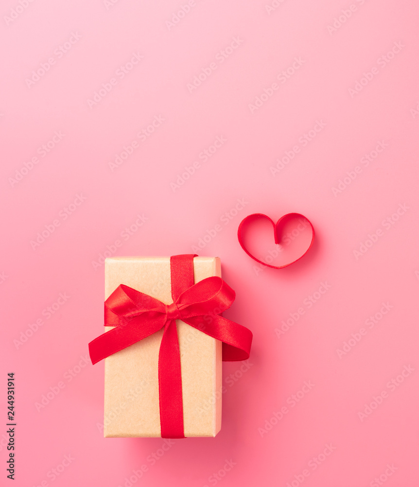 Giving present and celebration concept at Valentine's day, anniversary, mother's day and birthday surprise on pink background, copyspace, topview Giving present and celebration concept at Valentine's day, anniversary, mother's day and birthday surprise on pink background, copyspace, topview