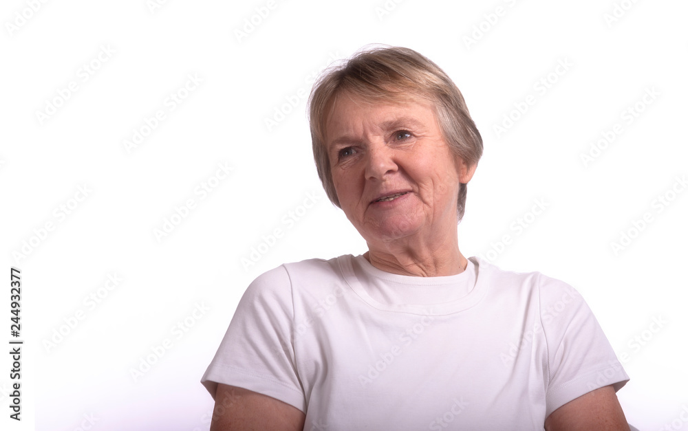 High key portrait of smiling mature woman, taken on a white background with copy space High key portrait of smiling mature woman, taken on a white background with copy space