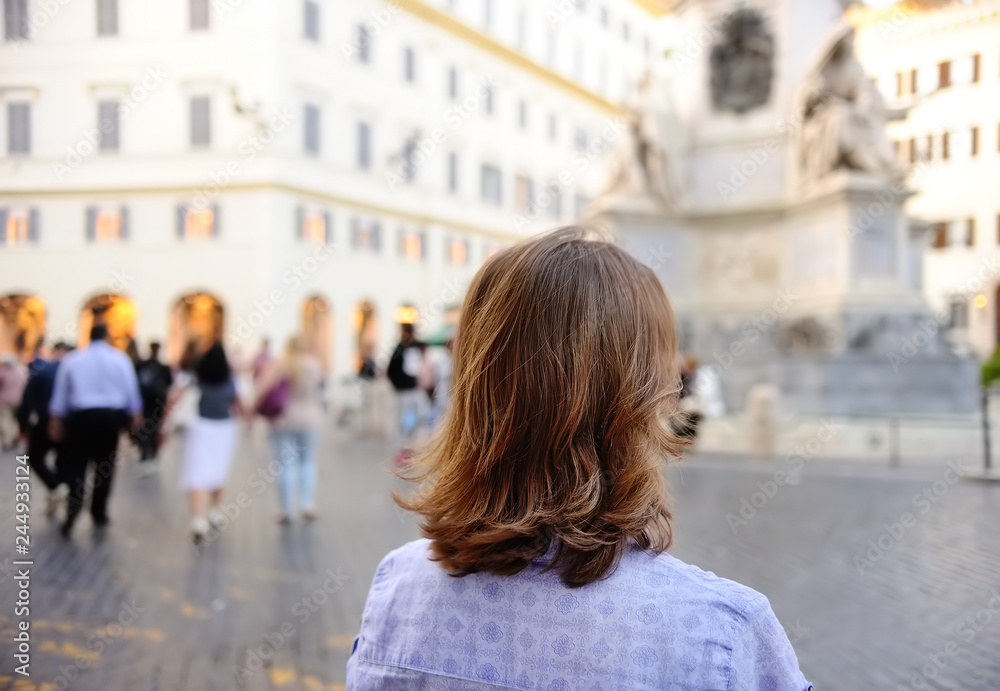 Young woman walks on square in Rome. Young woman walks on square in Rome.
