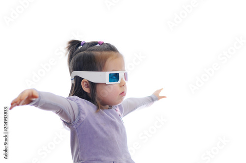little baby girl in 3D anaglyph cinema glasses for stereo image system with polarization. 3D googles with red and blue eyes. imagination flying