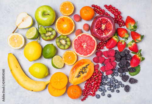 Fruits and berries rainbow top view.Natural vitamins and antioxidants food concept.