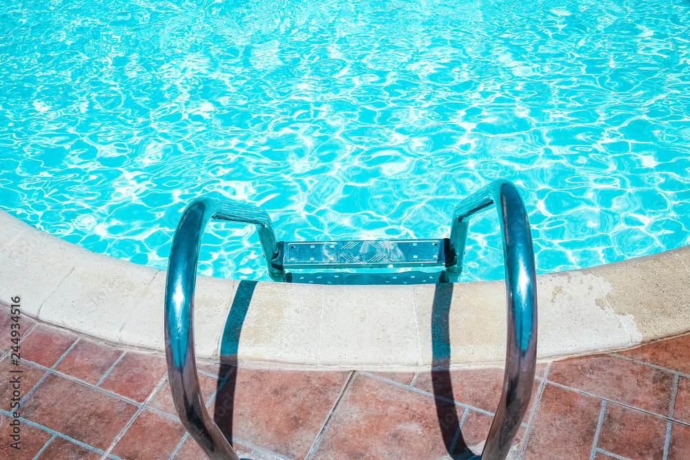 Beautifully stylish staircase steps in a swimming pool on nature sea background