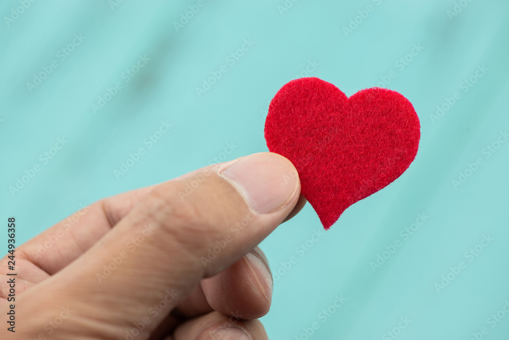 Red heart in hand, valentine's background Red heart in hand, valentine's background