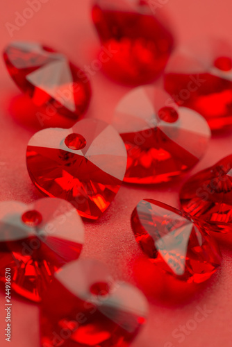 Red heart crystal on red paper, valentine's background