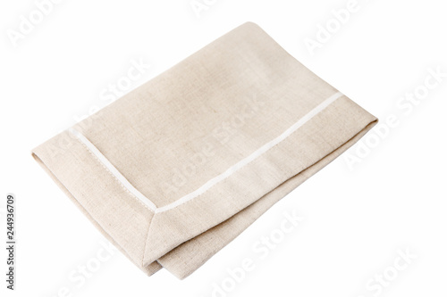 
Beige fabric napkin isolated on a white background.