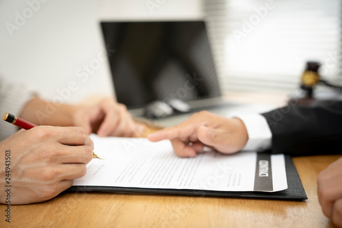 Banker business man and client signing contrac document for comfirm corporation or finished loan agreement for house or building property.Docum