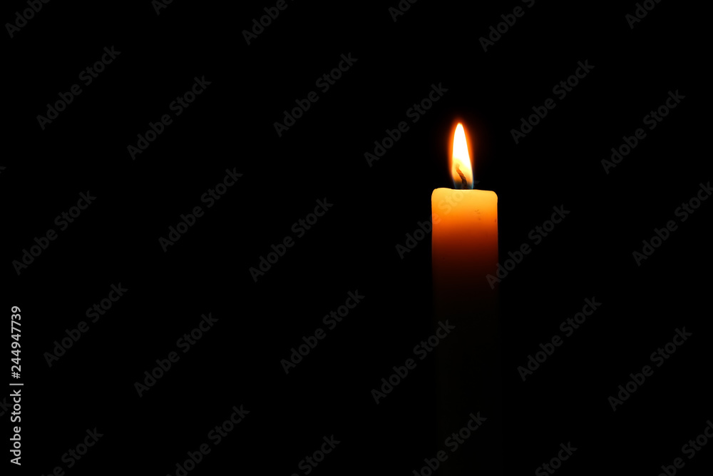 Burning candle in darkness Burning candle in darkness