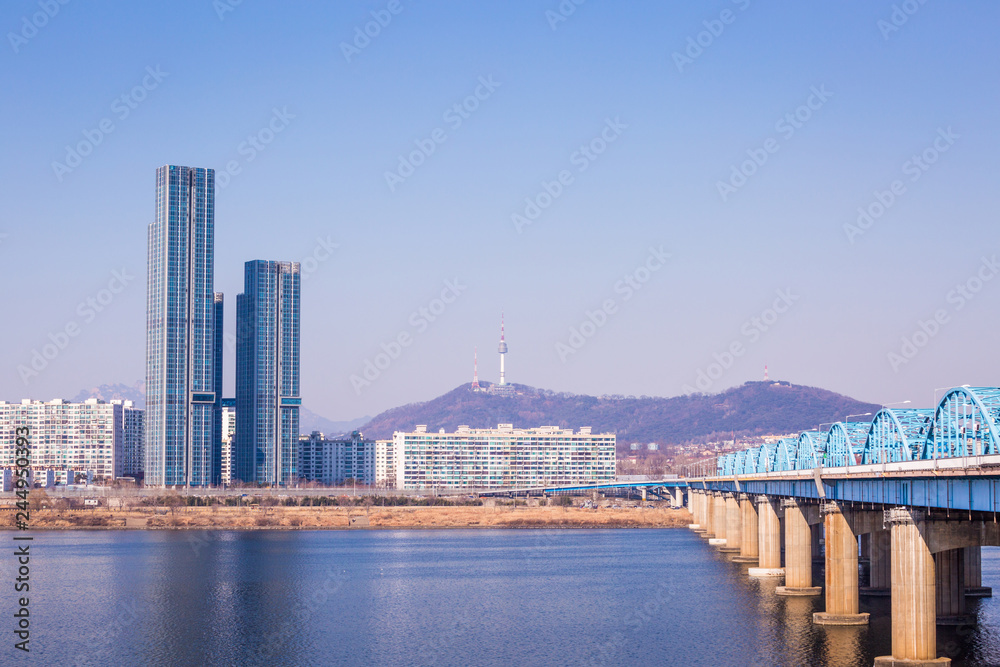 Seoul city and N Seoul Tower, or Namsan Tower, blue skies above Seoul, South Korea.