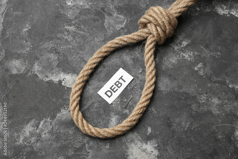 Fototapeta premium Rope with loop and word DEBT on grunge background