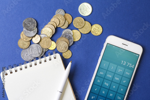 Notebook, coins and phone w...