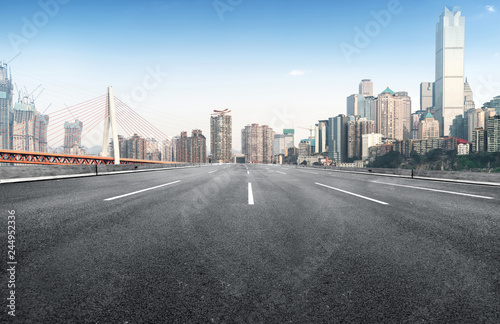 The expressway and the modern city skyline are in Chongqing  China.