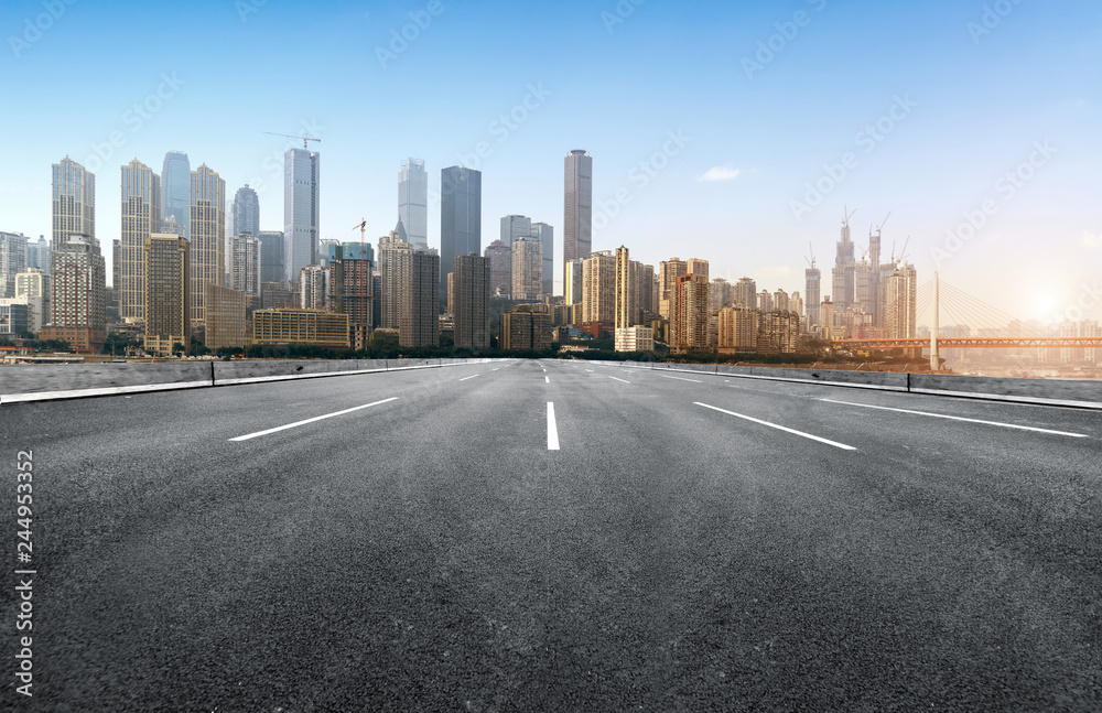 The expressway and the modern city skyline are in Chongqing, China. The expressway and the modern city skyline are in Chongqing, China.