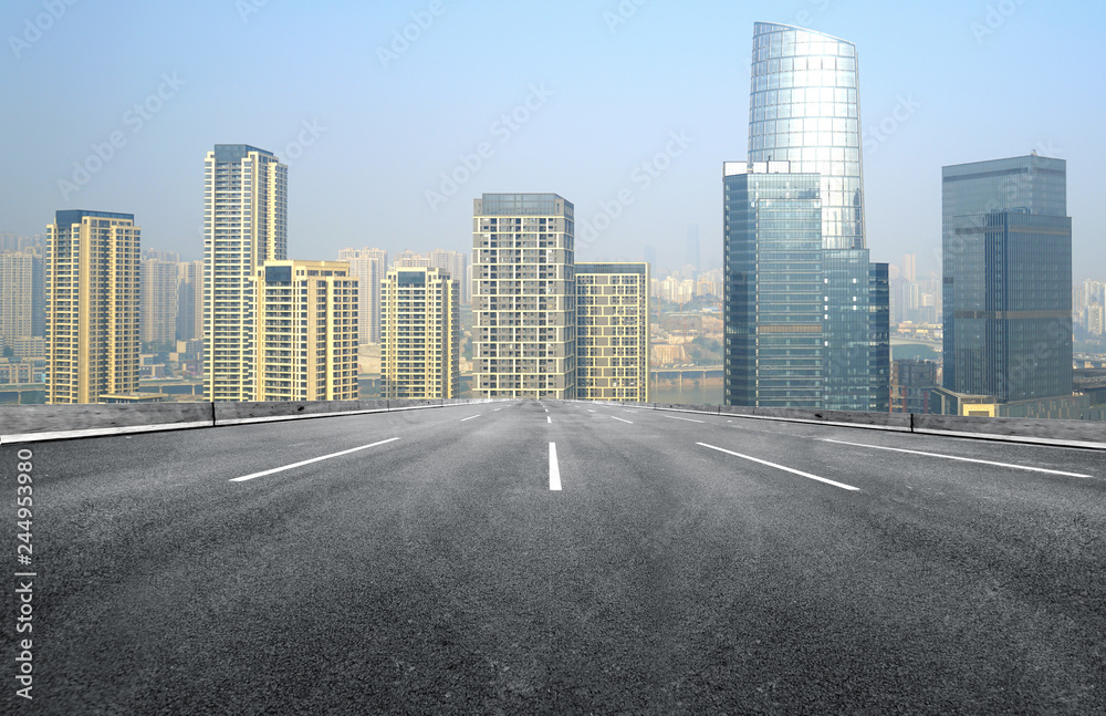 The expressway and the modern city skyline are in Chongqing, China.